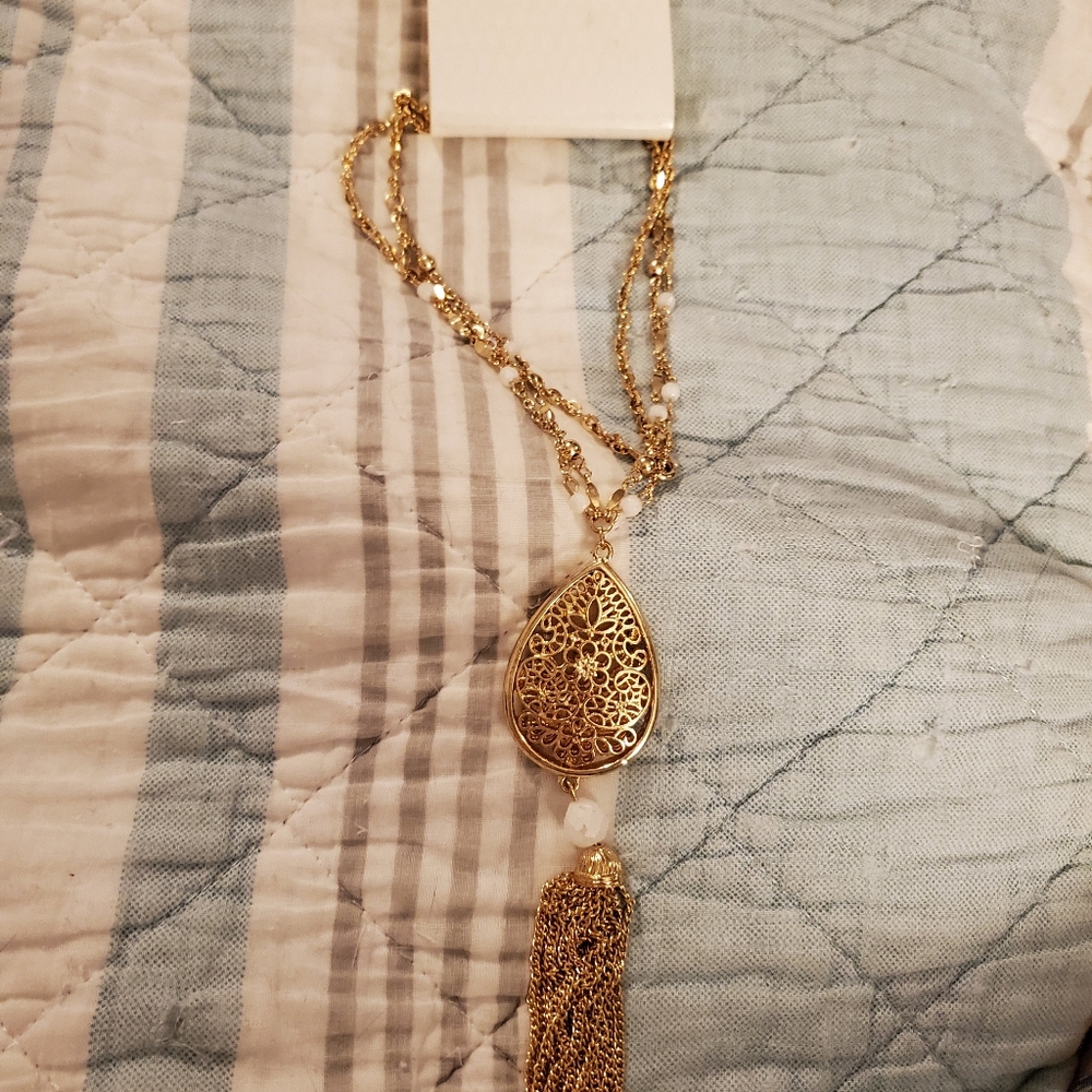 Gold pendant necklace with tassle
